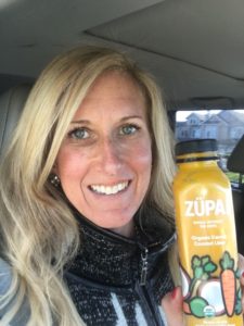 Meredith Kessler triathlete holding ZÜPA NOMA bottle Organic Carrot Coconut Lime
