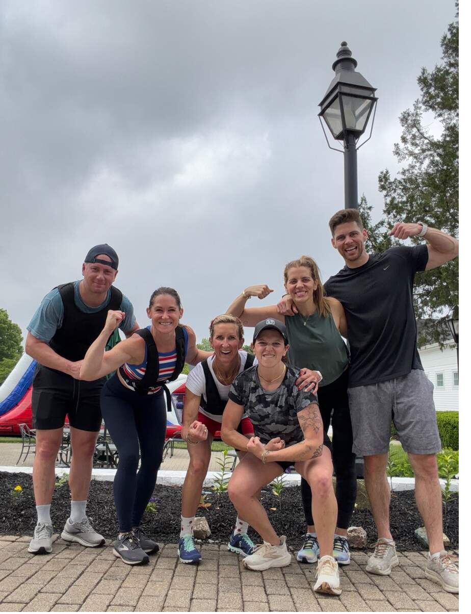 MBK athletes flexing and laughing together outdoors