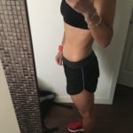 Meredith Kessler Triathlete baby bump in front of mirro