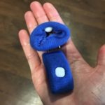 Meredith Kessler Triathlete holding blue wrist bands