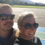 Meredith Kessler Triathlete With Husband Aaron Kessler Holding a Baseball