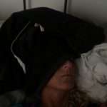 Meredith Kessler Triathlete Sleeping with Sweatshirt Covering Head